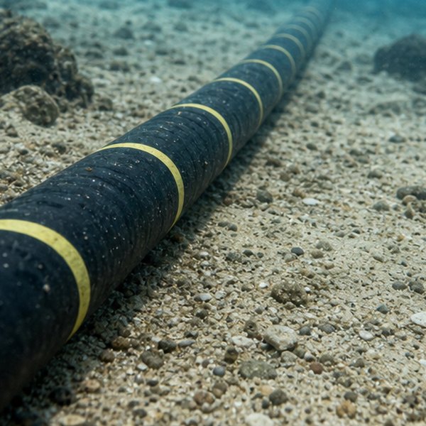 Underground fiber optic cables in ground — detail
